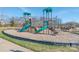 Community playground with slides, climbing structures, and a safe, fun environment for children to play at 1209 Cedar Park Dr, Pineville, NC 28134