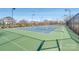 Well-maintained tennis court with surrounding fence at 1209 Cedar Park Dr, Pineville, NC 28134