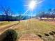 Landscaped backyard with steps and trees at 16480 Indian Mound Rd, Norwood, NC 28128