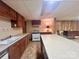 Basement kitchen with a stove, sink and island at 16480 Indian Mound Rd, Norwood, NC 28128