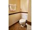 Bathroom with a toilet with unique patterned wallpaper at 16480 Indian Mound Rd, Norwood, NC 28128