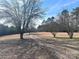 Long private driveway leading to a wooded area at 16480 Indian Mound Rd, Norwood, NC 28128