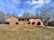 Brick ranch house with a large yard and attached garage at 16480 Indian Mound Rd, Norwood, NC 28128