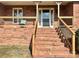 Brick steps and porch with railing at 16480 Indian Mound Rd, Norwood, NC 28128