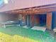 Outbuilding featuring large doors surrounded by lush green grass and trees at 16480 Indian Mound Rd, Norwood, NC 28128