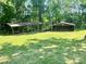Spacious backyard with outbuildings perfect for storage or hobbies at 16480 Indian Mound Rd, Norwood, NC 28128