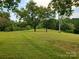 Expansive grassy lot with mature trees at 16480 Indian Mound Rd, Norwood, NC 28128