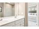 Double vanity bathroom with a shower and view of the bedroom at 1805 Woodlands Pointe Dr, Charlotte, NC 28216