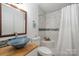 Clean bathroom with updated vanity and shower at 222 E Alabama Ave, Bessemer City, NC 28016