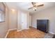 Well-lit bedroom with wood flooring and double closets at 222 E Alabama Ave, Bessemer City, NC 28016