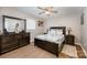 Spacious bedroom with a queen-size bed and dark wood furniture at 222 E Alabama Ave, Bessemer City, NC 28016