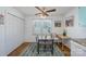 Bright dining area with a glass table and built-in corner desk at 222 E Alabama Ave, Bessemer City, NC 28016