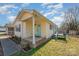 Side view of the house, highlighting the front porch and a deck at 222 E Alabama Ave, Bessemer City, NC 28016