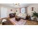 Living room with hardwood floors, neutral decor, and comfortable seating at 222 E Alabama Ave, Bessemer City, NC 28016