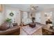 Living room featuring hardwood floors and a ceiling fan at 222 E Alabama Ave, Bessemer City, NC 28016