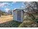 Metal storage shed with a single door and window at 222 E Alabama Ave, Bessemer City, NC 28016