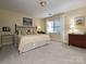 Bedroom with window seat and neutral color palette at 232 Perrin Pl, Charlotte, NC 28207