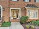 Inviting front entrance with a brick walkway leading to a double door entry at 232 Perrin Pl, Charlotte, NC 28207