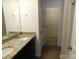 Bathroom with double vanity, granite countertops, and access to a closet at 274 Village Creek Way, Salisbury, NC 28147