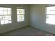 Bright bedroom with carpet flooring and large windows at 274 Village Creek Way, Salisbury, NC 28147