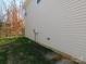 Tan vinyl sided exterior wall of the home at 274 Village Creek Way, Salisbury, NC 28147