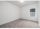 Bright bedroom featuring neutral wall colors and plush carpeting at 5513 Skycrest Dr, Charlotte, NC 28269