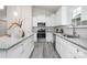 Modern kitchen featuring white cabinets, granite countertops, and stainless steel appliances at 5513 Skycrest Dr, Charlotte, NC 28269