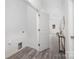 Convenient laundry area with built-in shelving at 5513 Skycrest Dr, Charlotte, NC 28269