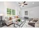 Open concept living room featuring a neutral color palette and plenty of natural light at 5513 Skycrest Dr, Charlotte, NC 28269