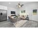 Bright living room with large windows and comfortable furniture at 5513 Skycrest Dr, Charlotte, NC 28269