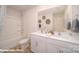Bright bathroom with dual sinks, white cabinets, and a shower-tub combination at 126 Rustling Waters Dr, Mooresville, NC 28117