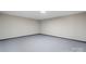 Empty, unfinished basement room with grey carpet at 1816 31St Ne St, Hickory, NC 28601