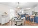 Kitchen with a dining area and modern blue cabinets at 2124 Caleo Cir, Charlotte, NC 28270