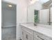 Bathroom features white cabinetry, granite countertop, and large mirror at 320 Triple Ponds Ct, Clover, SC 29710