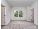 A bedroom offering neutral walls, carpet, window and doorways at 320 Triple Ponds Ct, Clover, SC 29710