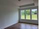 Bright, spacious bedroom with large windows offering scenic views, and plush carpeting at 320 Triple Ponds Ct, Clover, SC 29710