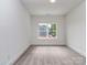 A comfortable bedroom with plush carpeting, white walls, and natural light at 320 Triple Ponds Ct, Clover, SC 29710