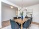Cozy dining area with hardwood floors, white trim, and room for six chairs at 320 Triple Ponds Ct, Clover, SC 29710