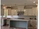Modern kitchen featuring stainless steel appliances, a center island, and ample cabinet space at 320 Triple Ponds Ct, Clover, SC 29710