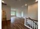 Spacious living area with hardwood floors, providing a versatile and inviting atmosphere at 320 Triple Ponds Ct, Clover, SC 29710