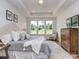 This bright main bedroom features tray ceilings, large windows, and natural light at 320 Triple Ponds Ct, Clover, SC 29710