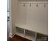 Functional mudroom with built-in bench, storage cubbies, and coat hooks for organized entry at 320 Triple Ponds Ct, Clover, SC 29710