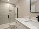 Modern bathroom featuring marble tiled shower, glass doors, and stylish fixtures at 409 Mint St, Rock Hill, SC 29730