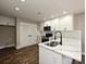 Modern kitchen with stainless steel appliances, subway tile backsplash, and quartz countertops at 409 Mint St, Rock Hill, SC 29730
