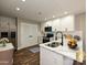 Beautiful kitchen with stainless steel appliances, white cabinetry, and quartz countertops at 409 Mint St, Rock Hill, SC 29730