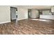 Open-concept living space with hardwood floors and views to kitchen and other rooms at 409 Mint St, Rock Hill, SC 29730
