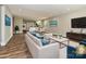 Open concept living area and kitchen with modern decor, hardwood flooring, and natural light at 409 Mint St, Rock Hill, SC 29730
