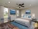 Beautifully staged bedroom with large bed, soft lighting, and decorative wall art at 409 Mint St, Rock Hill, SC 29730