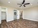 Main bedroom with closet, bathroom, hardwood floors and neutral walls at 409 Mint St, Rock Hill, SC 29730