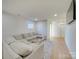 Spacious basement featuring hardwood floors and a sectional sofa at 8039 Mcconnell Rd, Denver, NC 28037